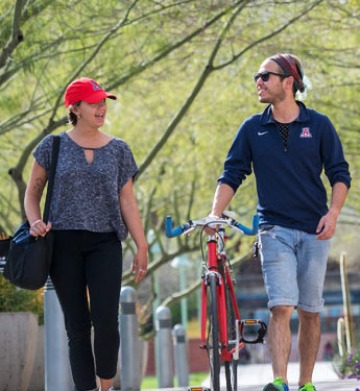 students walking with bike